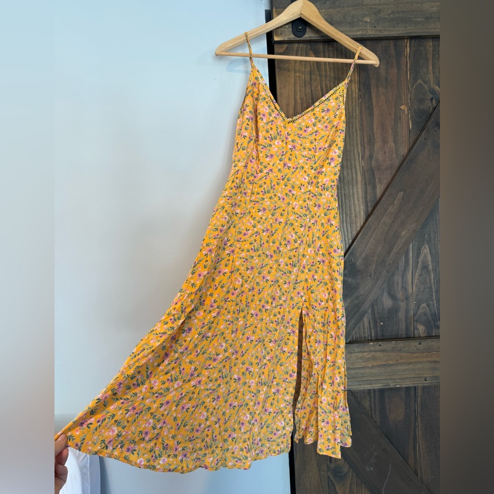 Lulu’s yellow floral sundress. I am 5’2 this went down to my knees.